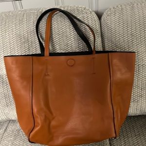 Over size brown leather bag.
